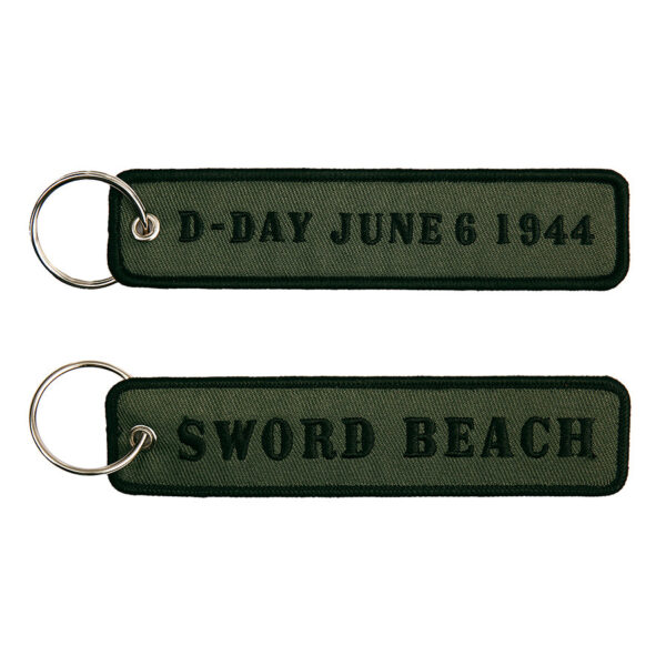 251305 1590 75 01 <p>De Sleutelhanger D-Day Sword Beach #83 is een stijlvolle en praktische accessoire gemaakt van 100% nylon. Met een afmeting van 12,5 x 3 cm is deze sleutelhanger perfect voor het veilig en overzichtelijk houden van je sleutels. Verkrijgbaar in diverse kleuren, voegt het een unieke touch toe aan je dagelijkse uitrusting. Deze sleutelhanger is niet alleen functioneel, maar ook een eerbetoon aan de geschiedenis van D-Day, waardoor het een bijzondere toevoeging is aan jouw collectie.</p>