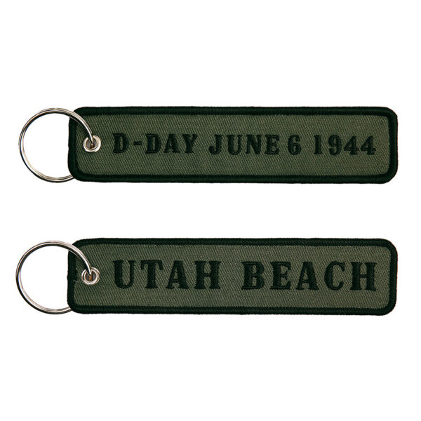 251305 1592 75 01 <p>De Sleutelhanger D-Day Utah Beach #82 is een stijlvolle en praktische accessoire gemaakt van 100% nylon. Met een afmeting van 12,5 x 3 cm is deze sleutelhanger ideaal voor het veilig en gemakkelijk vasthouden van je sleutels. Verkrijgbaar in diverse kleuren, voegt deze sleutelhanger niet alleen functionaliteit toe, maar ook een vleugje geschiedenis aan je dagelijkse uitrusting.</p>