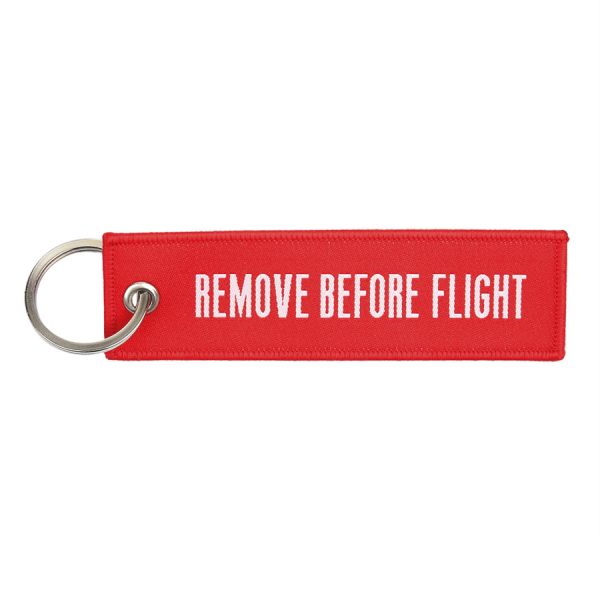 251200 11004 Sleutelhanger fijn geweven remove before flight 98 Zeer fijn geweven sleutelhanger van 100% stof. Door de fijne weving is dit embleem zeer gedetailleerd.